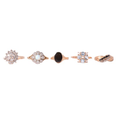 Lot 131 - Four gold gemset rings, and one gilt white metal gemset ring.