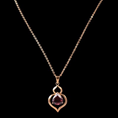 Lot 248 - A garnet pendant on a chain, and matching earrings.