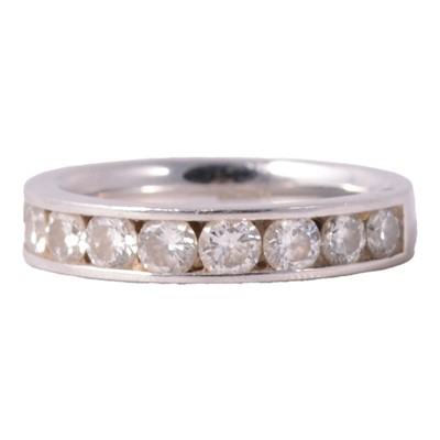 Lot 104 - A diamond half eternity ring.