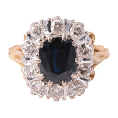 Lot 5 - A sapphire and diamond cluster ring.