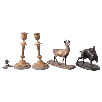 Lot 100 - After Mene, a patinated spelter whippet group, gilt deer sculpture, and a pair of candlesticks