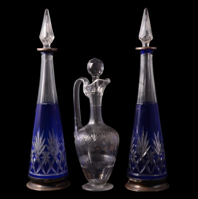 Lot 28 - Pair of blue overlaid cut glass decanters and a claret jug