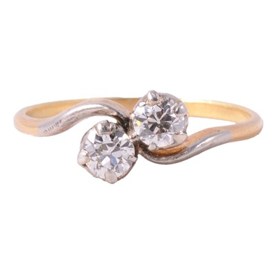 Lot 70 - A diamond two stone crossover ring.