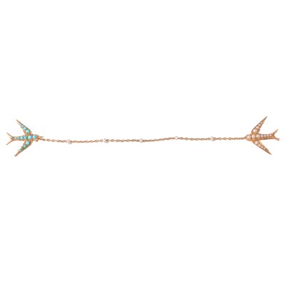 Lot 218 - A turquoise and seed pearl flying swallows brooch.