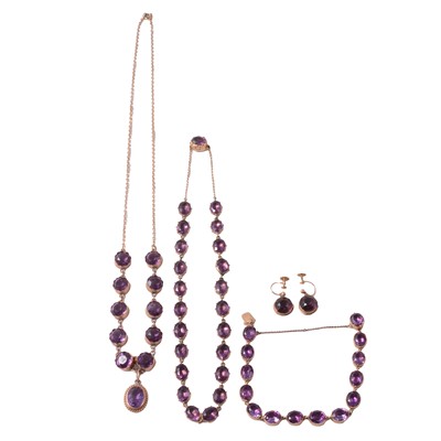Lot 261 - Two amethyst and purple stone necklaces, bracelet and purple paste earscrews.