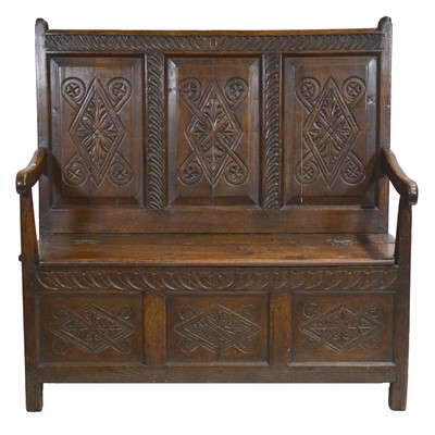Lot 512 - An 18th century joined oak settle