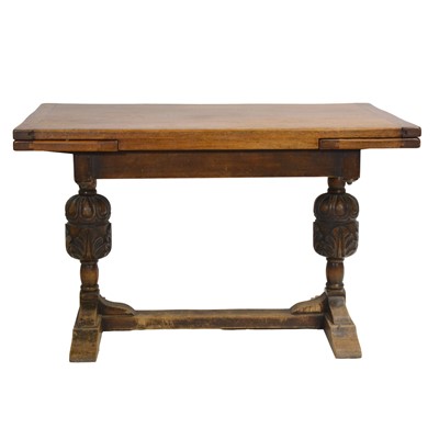 Lot 496 - Oak draw leaf kitchen table and six Windsor style chairs