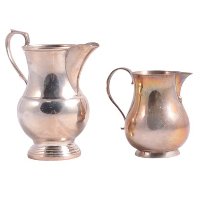 Lot 335 - Two silver cream jugs.