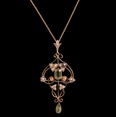 Lot 381 - A peridot and seed pearl pendant brooch on a chain.