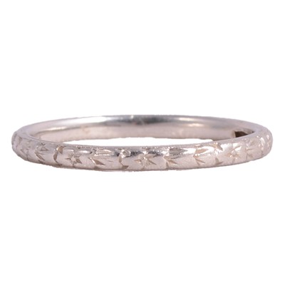 Lot 163A - A white metal wedding band.