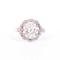 Lot 179 - A pearl and diamond circular cluster ring, a...