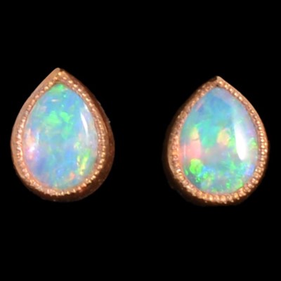 Lot 192 - A pair of 18 carat yellow gold opal earstuds.