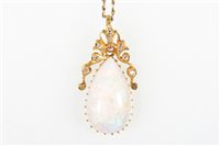 Lot 197 - An opal and diamond pendant and chain, the...