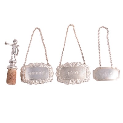 Lot 383 - Three silver decanter labels, and a silver bottle stopper.