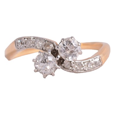 Lot 84 - A diamond two stone crossover ring.