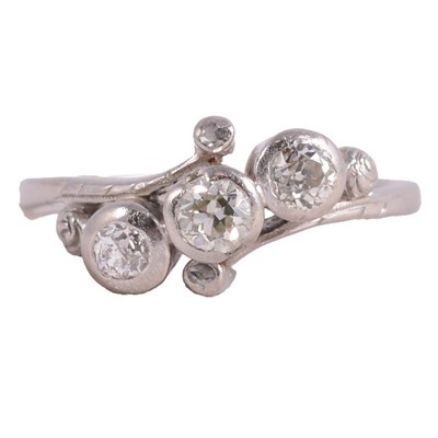 Lot 51 - A diamond three stone ring.