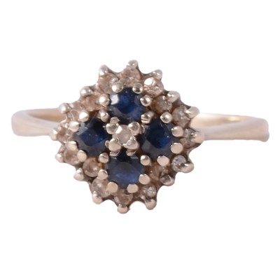 Lot 258 - A sapphire and diamond cluster ring.