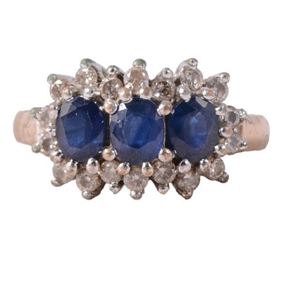 Lot 50 - A sapphire and diamond triple cluster ring.