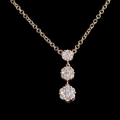 Lot 402 - A diamond triple cluster pendant and chain.