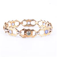 Lot 216 - A yellow metal bracelet with eight polished...