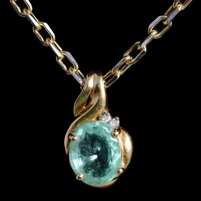 Lot 375 - A Paraiba tourmaline and diamond pendant. and chain.