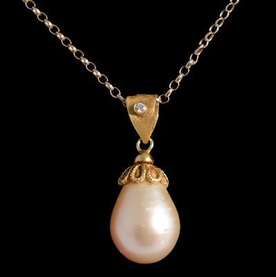 Lot 260 - A pearl drop pendant on a chain.
