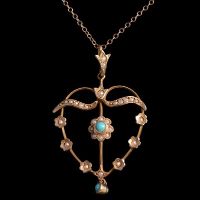 Lot 380 - A turquoise and seed pearl pendant on a chain.