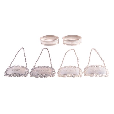 Lot 344 - Two pairs of silver wine labels and a pair of silver napkin rings