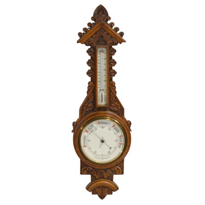 Lot 550 - Late Victorian carved oak aneroid barometer