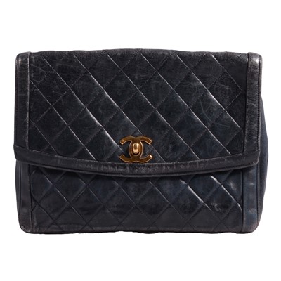 Lot 1176 - Chanel - a vintage navy quilted leather flap bag with box and dust bag.