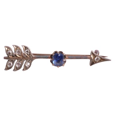 Lot 235 - A small diamond set arrow brooch.