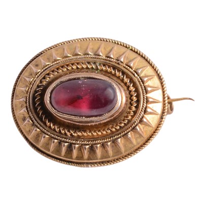 Lot 251 - A Victorian yellow metal oval target brooch.