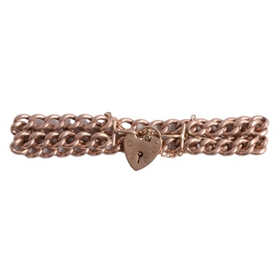 Lot 295 - A rose metal two row curb link bracelet.