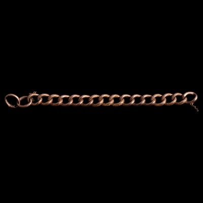 Lot 299 - A rose metal curb link bracelet (no fastener).