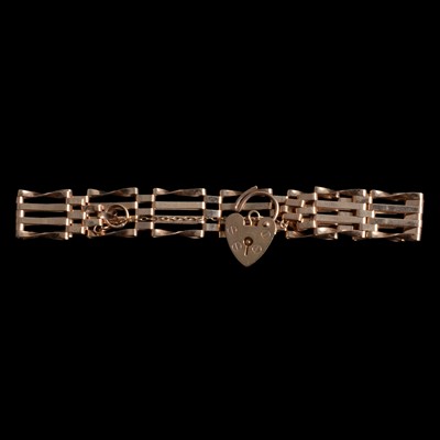 Lot 304 - A 9 carat yellow gold four bar gate link bracelet.