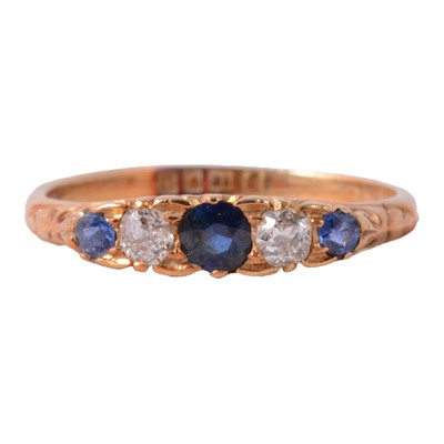 Lot 25 - A sapphire and diamond ring.