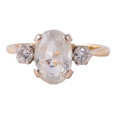Lot 68 - A very pale blue gemstone and diamond three stone ring.