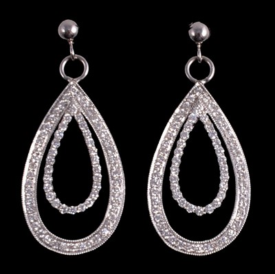 Lot 432 - A pair of diamond set double hoop earrings.