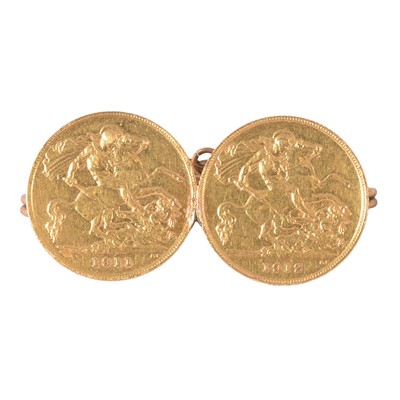Lot 220 - A brooch set with two Gold Half Sovereign Coins.