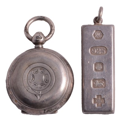 Lot 1241 - A silver ingot pendant, and a silver sovereign case.