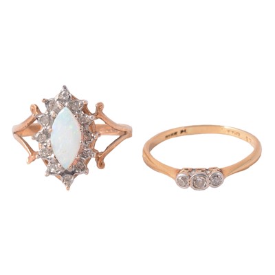 Lot 41 - A diamond three stone ring, and an opal and diamond dress ring.