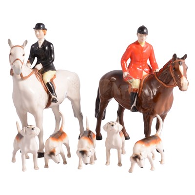 Lot 38 - Beswick, a Huntsman, Huntswoman, and five hound figurines