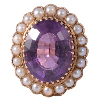 Lot 112 - A large amethyst and pearl dress ring.
