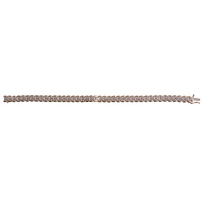 Lot 282 - A diamond tennis bracelet in 9 carat yellow and white gold.