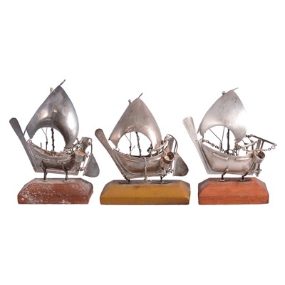 Lot 353 - Three white metal Dhows.