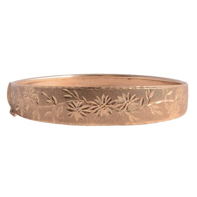Lot 265 - A yellow metal half hinged bangle.