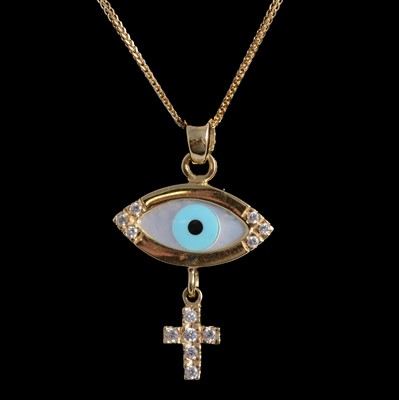 Lot 407 - A mother-of-pearl and white stone (not diamond) cross and eye pendant on a chain.