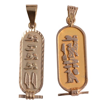 Lot 411 - Two yellow metal Ancient Egyptian style cartouche pendants.