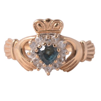 Lot 66 - A heat-treated blue topaz and cubic zirconia Irish claddagh ring.