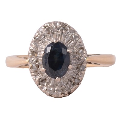 Lot 47 - A sapphire and diamond ring.